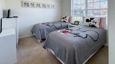 a bedroom with two beds with hello kitty beds at Tequilla Sunrise at Windsor Hills in Orlando