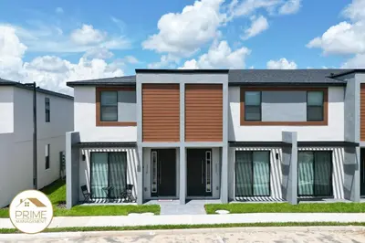 a rendering of a house with a driveway at New 3BD3BA Townhouse Themed Near Disney in Kissimmee
