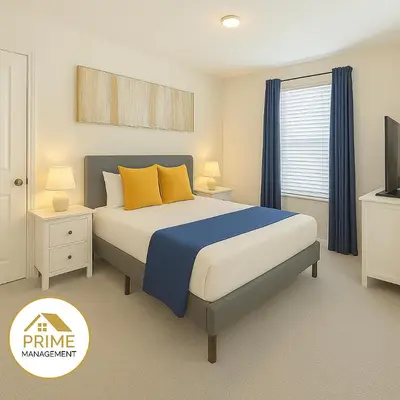 a bedroom with a bed with blue and yellow pillows at New 3BD3BA Townhouse Themed Near Disney in Kissimmee