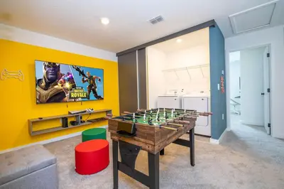 a game room with a foos ball on a table at 3221 Brand New Family 3BD Townhouse near Disney in Kissimmee