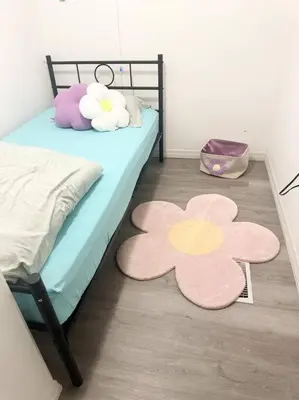 a bedroom with a bed with flowers on the floor at The Pink House of Celebration in Kissimmee