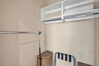 a kitchen with white walls and a white cabinet at 3 Bedroom 4 Bathroom Magic Village 3099 in Orlando