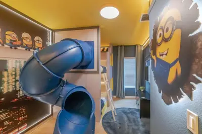a childs room with a room with a superhero mural at 5 Bedroom 5 Bathroom Paradiso Grande 10352 in Orlando