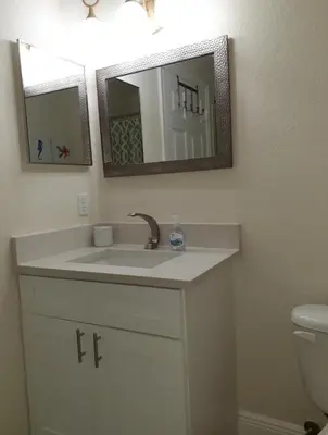a bathroom with a sink and a mirror at Venetian Bay Villages in Kissimmee