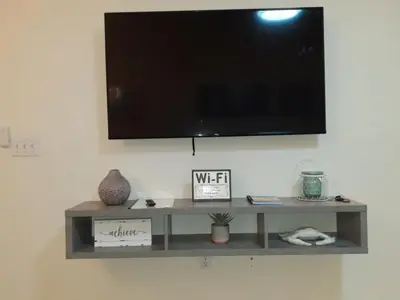 a shelf with a television on a wall at Venetian Bay Villages in Kissimmee