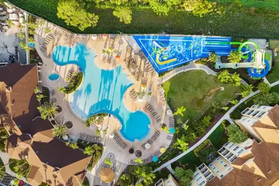 an overhead view of a swimming pool in a resort at Elegant Townhome w Water Park near Disney Parks in Orlando