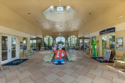 a building with a lobby with a large character on the floor at Windsor Hills Condo: Water Park Included in Orlando