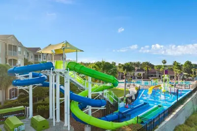 a water park with a water slide at a resort at Delight Condo Water Park Near Disney Parks in Orlando