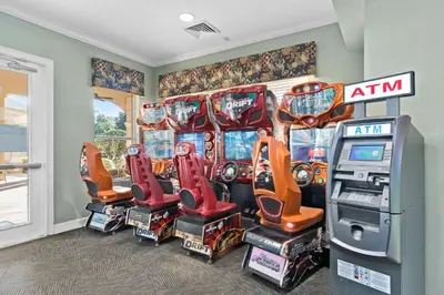 a group of pinball machines in a room at Delight Condo Water Park Near Disney Parks in Orlando