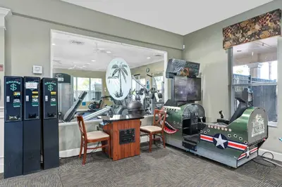a room with a room with machines in it at Delight Condo Water Park Near Disney Parks in Orlando