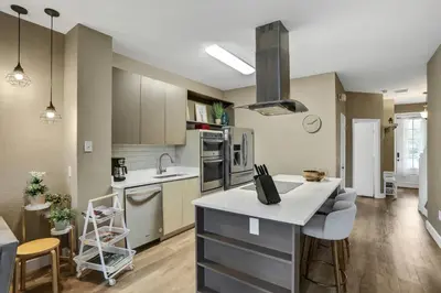 a kitchen with a counter top in a room at Water Park Haven: Spacious 3BR Windsor Hills in Orlando