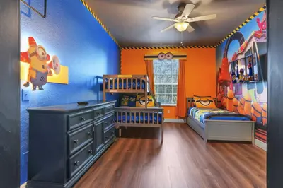 a room with a childs bedroom with blue and orange at Elegant Getaway Windsor Hills Condo w Water Park in Orlando