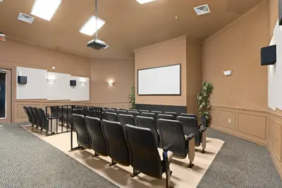 a conference room with black chairs and a screen at Elegant Getaway Windsor Hills Condo w Water Park in Orlando