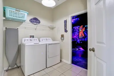 a laundry room with a washer and dryer at Family Fun Haven: Spacious Villa Water Park in Orlando