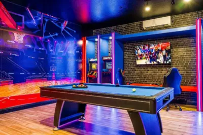 a billiard room with a pool table in the middle at Family-Friendly Villa Resort: Free Water Park in Orlando