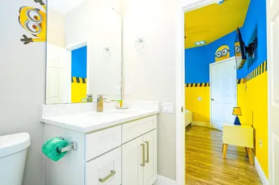 a bathroom with a sink and a mirror at Family-Friendly Villa Resort: Free Water Park in Orlando