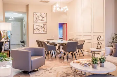 a living room with a table and chairs at NEW Spectacular Home Windsor Hills in Orlando