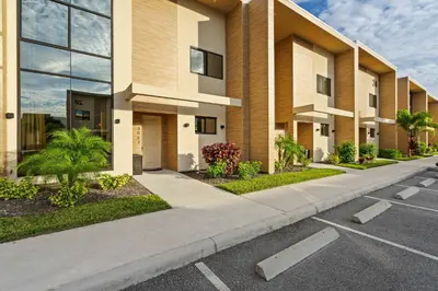 a parking lot in front of a building at Elegant Escape: 4BR Villa near Disney Views in Orlando