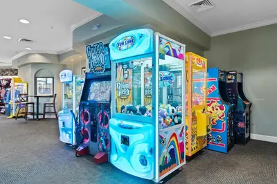 a row of arcade games in a room at Windsor Hills Getaway: Condo with Water Park in Orlando