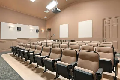 an empty lecture room with rows of chairs at Windsor Hills Getaway: Condo with Water Park in Orlando