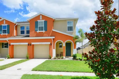 a house with an orange at Family Paradise 4BR Compass Bay Townhome Sleeps 11 in Kissimmee