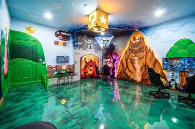 a room with a swimming pool with a painting on the wall at Themed Retreat 6BR w Magical Rooms Private Pool in Orlando