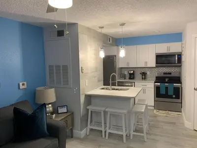 a kitchen with a sink and a stove top oven at Villa del Sol in Kissimmee