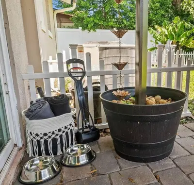 a patio with a bowl of food and a potted plant at New Design-Movie Night Bar-Fire Pit-Hammocks-Games in Orlando