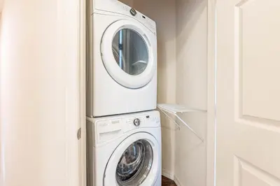 a washer and dryer in a laundry room at Corner Villa in West Lucaya – Your Ideal Getaway in Kissimmee