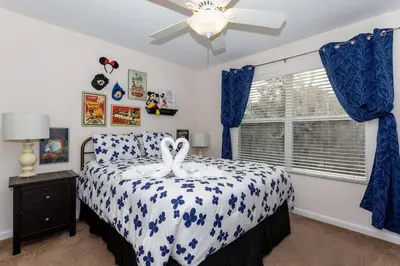 a bedroom with a bed and a ceiling fan at Large Deck, Lakefront, Yard Games in Orlando