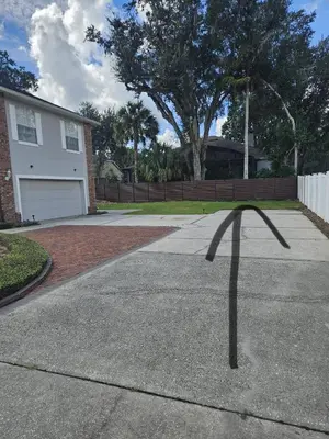 a shadow of a house on a driveway at Newly Renovated Modern Studio in Oviedo