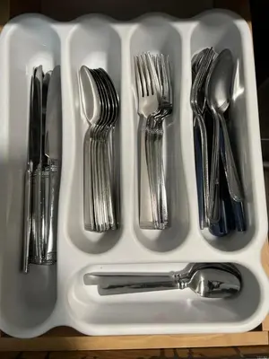 a white tray with silver utensils on a table at Tranquil Haven 2BD 2BA Paradise 10min to Orlando's Best Theme Parks in Orlando