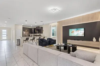 a living room with a couch and a table at 4561 Majestic 9BD Kingdom Retreat Near Disney in Kissimmee