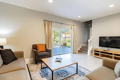 a living room with a couch and a coffee table at 3Q/2.5B ✰ Jacuzzi ✰ Cama King in Kissimmee