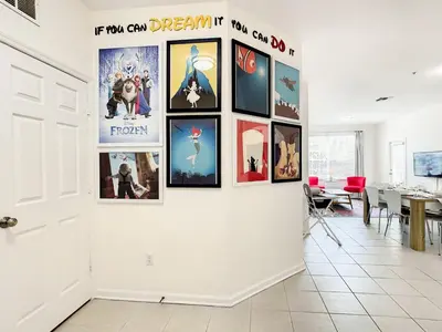 a wall full of pictures on a wall at Windsor Hills Luxury Condo, Pool,Slides, By Disney in Orlando