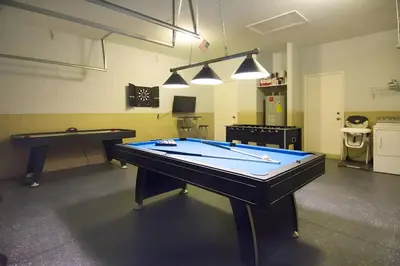 a ping pong table in a ping pong room at Free Water Park 4BR wPool Game Room 7739TB in Orlando