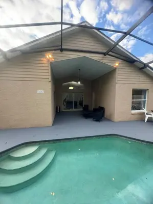 a house with a swimming pool in the backyard at Family Dream Home Near Disney in Kissimmee