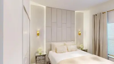 a white bedroom with a bed and a window at Storey Lake Resort 1119 - Hosted by Top Villas in Kissimmee