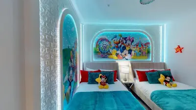 a bedroom with two beds in a room with a surfboard at Storey Lake Resort 1119 - Hosted by Top Villas in Kissimmee