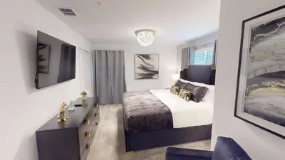 a bedroom with a bed and a dresser in it at Storey Lake Resort 1119 - Hosted by Top Villas in Kissimmee