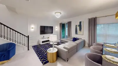 a living room with a couch and a table at Storey Lake Resort 1119 - Hosted by Top Villas in Kissimmee