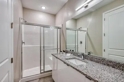 a bathroom with two sinks and a shower at Formosa Valley Resort 59 - Hosted by Top Villas in Orlando
