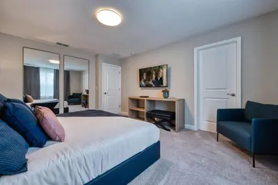 a bedroom with a bed and a desk and a chair at Formosa Valley Resort 59 - Hosted by Top Villas in Orlando