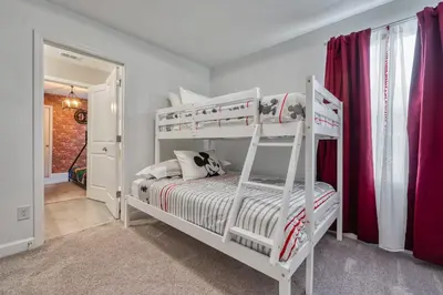 a white bedroom with two bunk beds in it at Formosa Valley Resort 59 - Hosted by Top Villas in Orlando