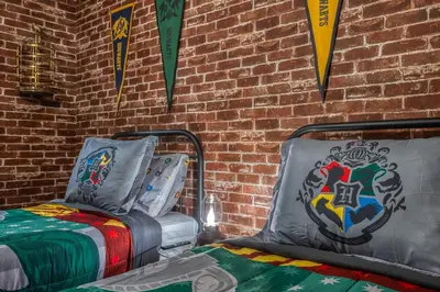 a room with two beds and flags on a brick wall at Formosa Valley Resort 60 - Hosted by Top Villas in Orlando