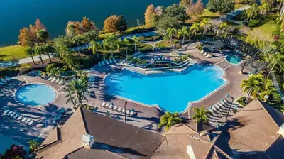 an aerial view of a resort with two pools at Last Minute Disney Getaway Luxury Condo with Private Balcony. Book Now VC240 in Orlando