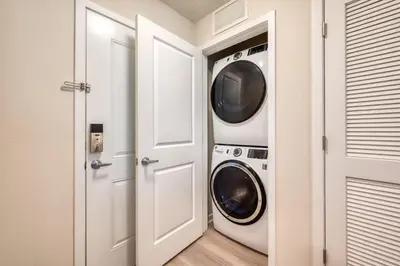 a laundry room with a washer and dryer at Vista Cay 239 - Hosted by Top Villas in Orlando