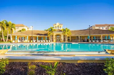 a swimming pool in front of a house at Vista Cay 239 - Hosted by Top Villas in Orlando