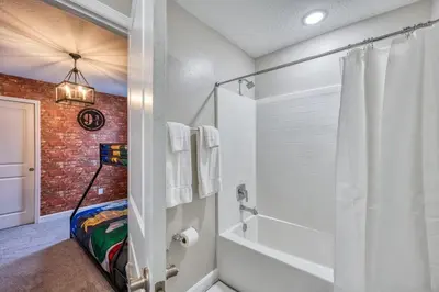a bathroom with a brick wall and a shower at Formosa Valley Resort 58 - Hosted by Top Villas in Orlando