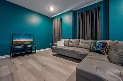 a living room with a couch and a flat screen tv at Storey Lake Resort 1120 - Hosted by Top Villas in Kissimmee